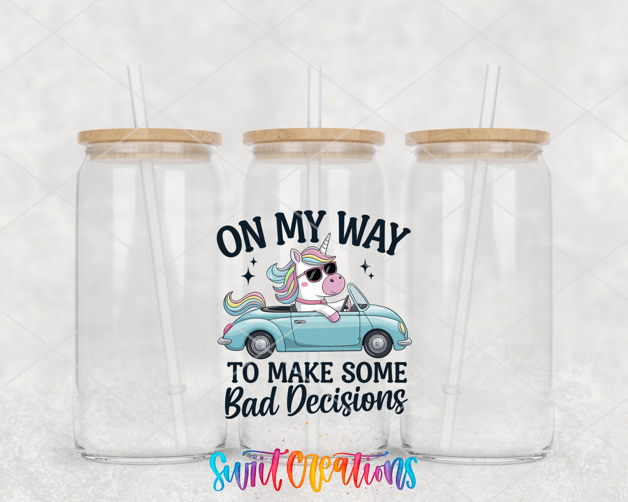 two clear tumblers with a unicorn driving a car