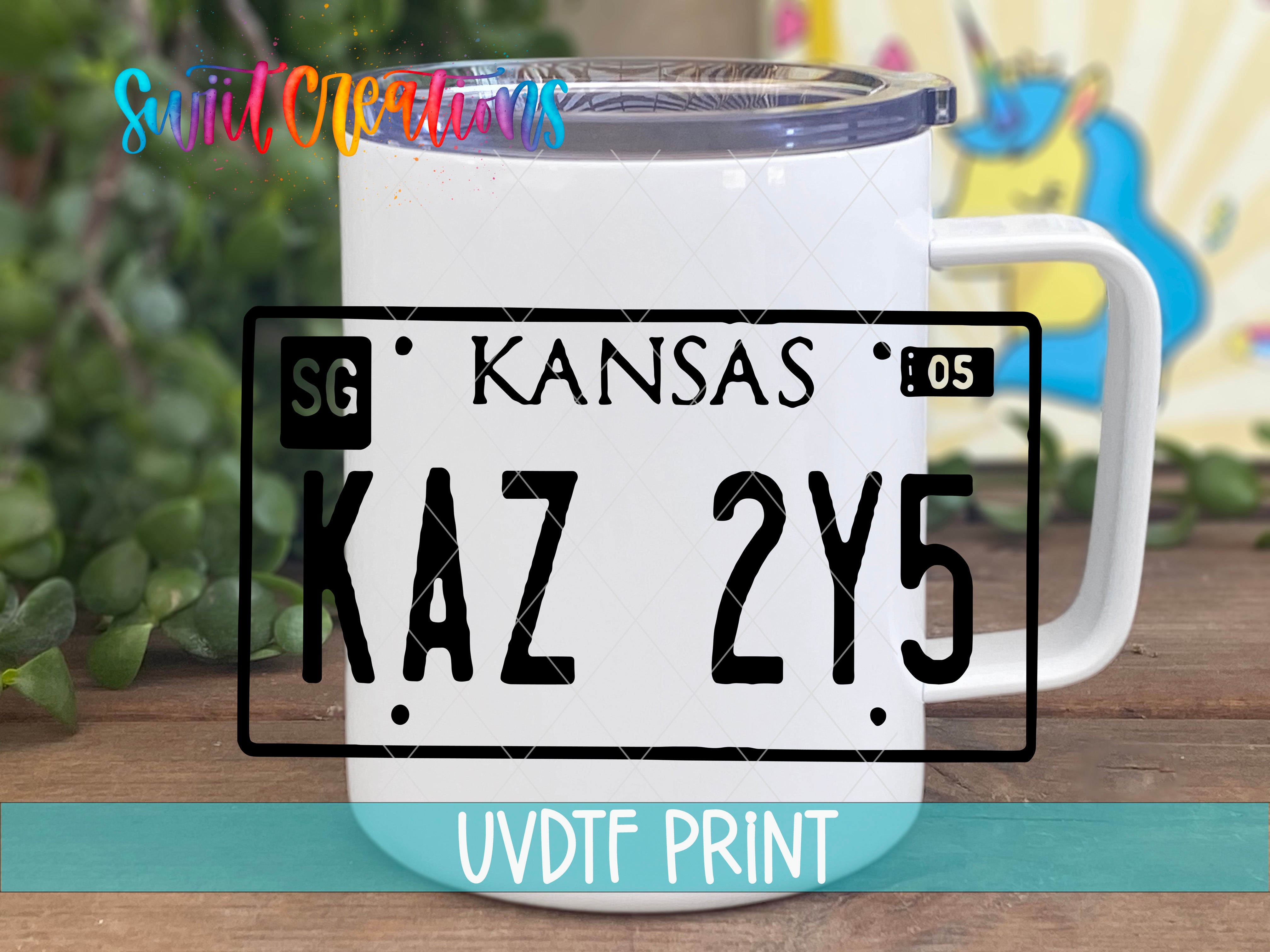 a white coffee mug with a kansas license plate