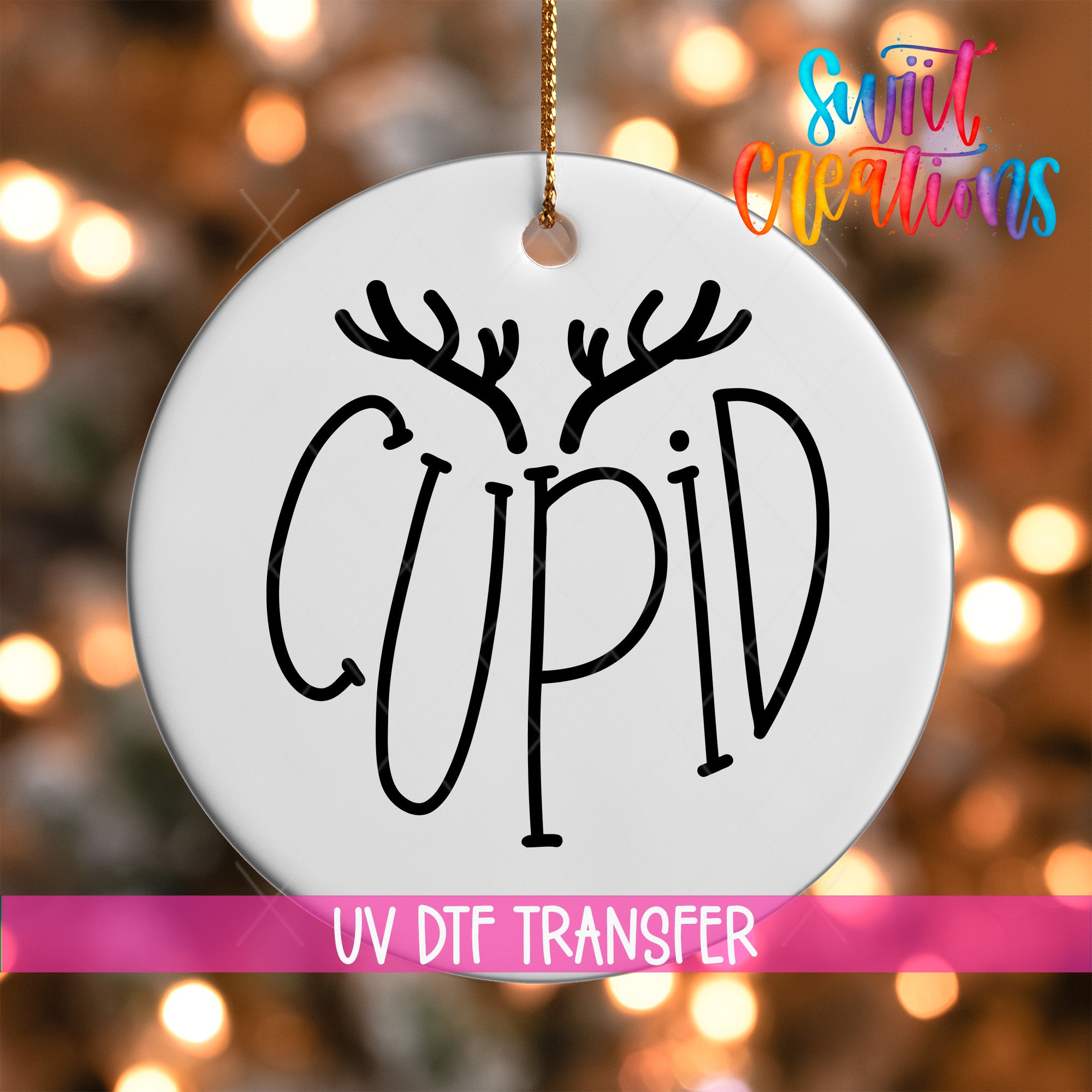 A white ornament with the word "CUPID" written on it, hanging against a background of colorful lights.