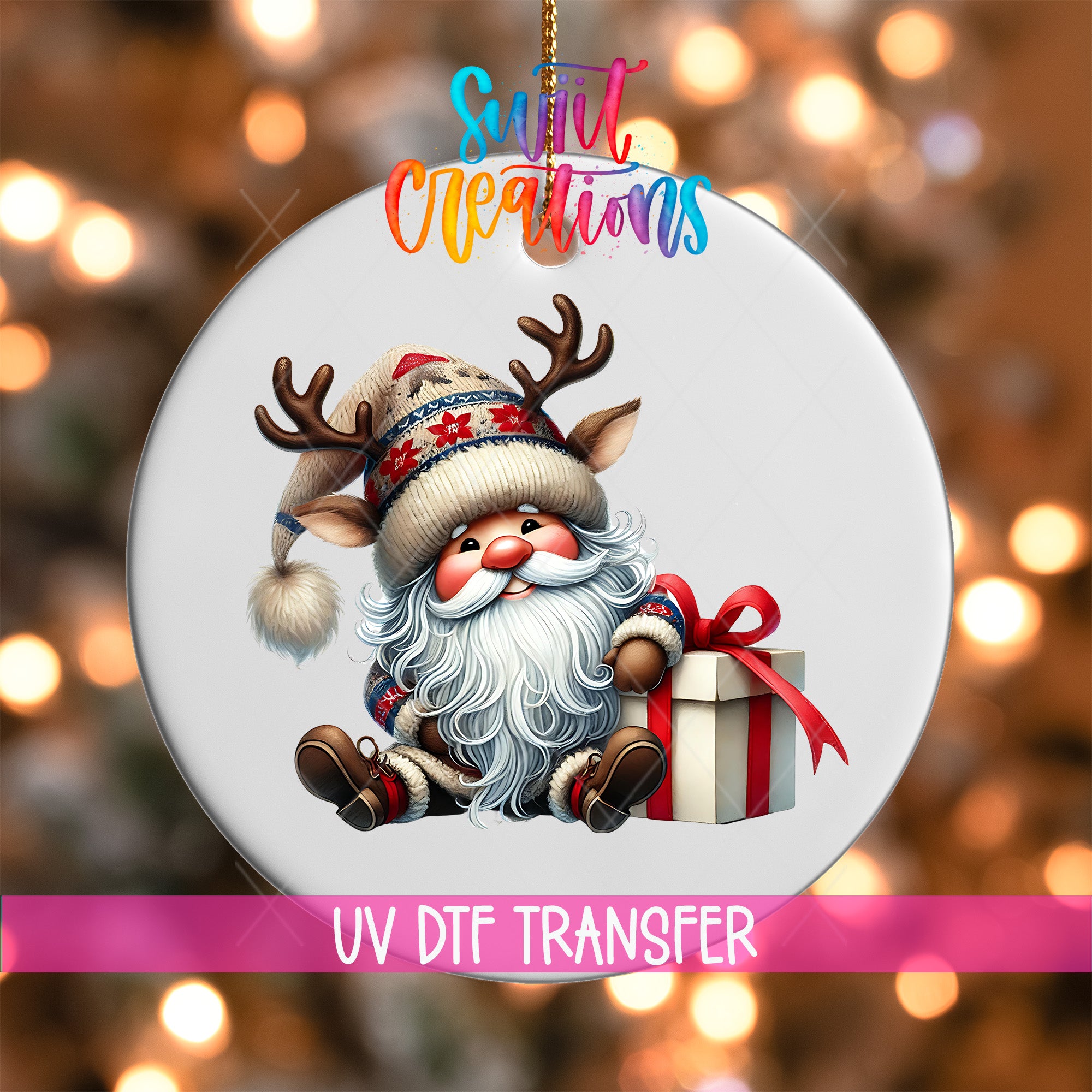 A white ornament with a Santa Claus character holding a gift box, surrounded by a blurred background of Christmas lights.