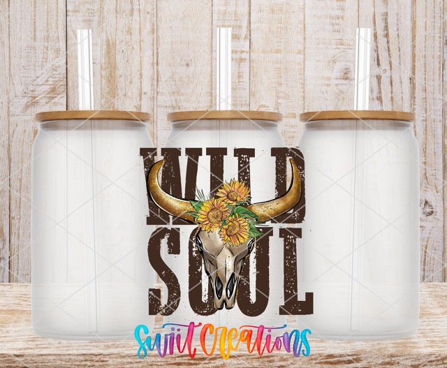 two white mugs with a cow skull and sunflowers on them