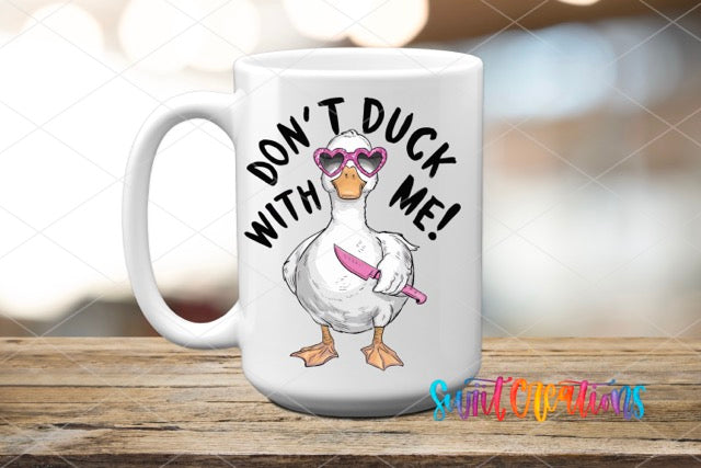 a white coffee mug with a duck wearing sunglasses