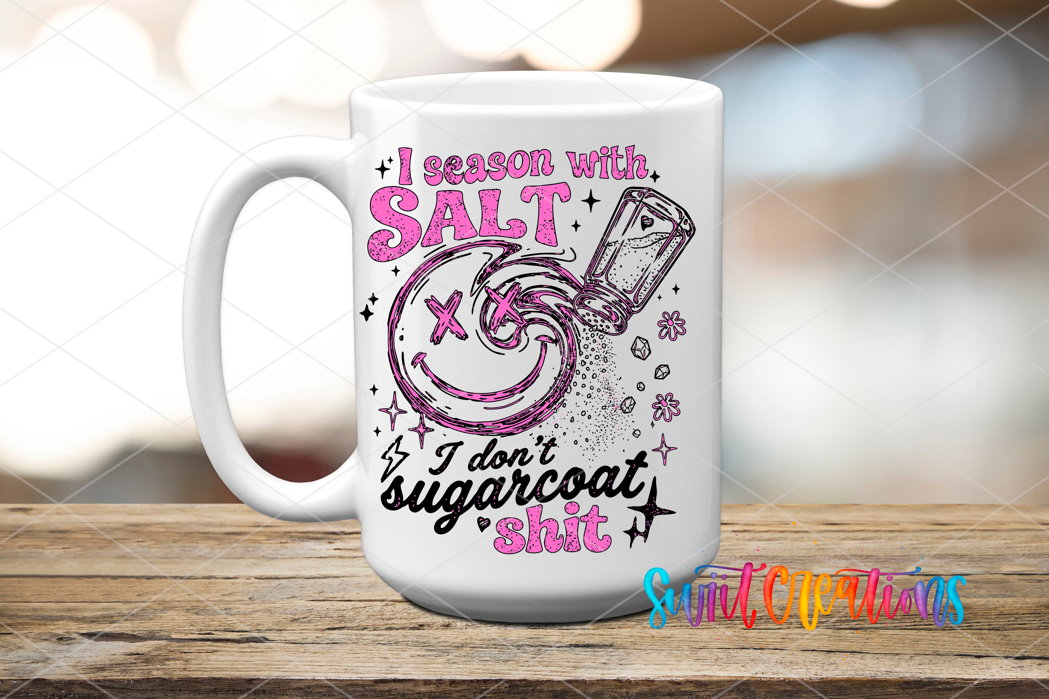 A white mug with a colorful graphic design featuring a salt shaker and text that reads "I season with salt, I don't sugarcoat it, I don't sugarcoat it".