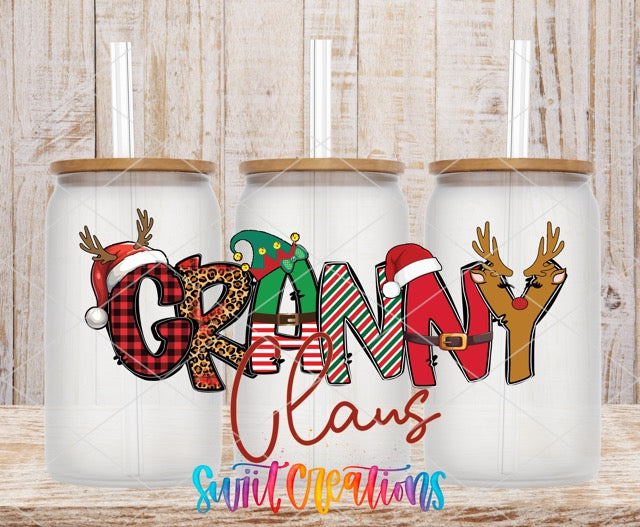 three personalized christmas mugs on a wooden table