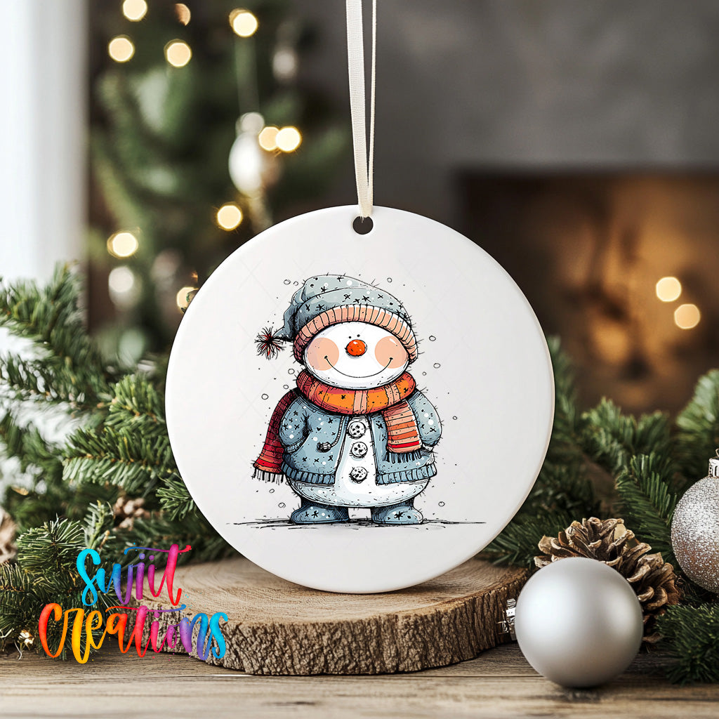 A white ceramic ornament featuring a snowman with a scarf and hat, surrounded by Christmas decorations and greenery.
