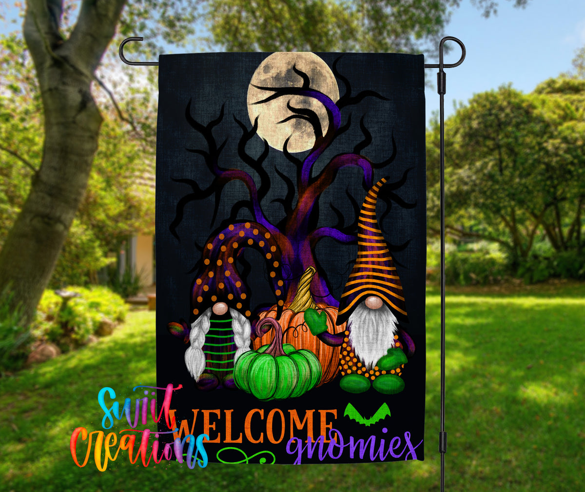 A Halloween-themed garden flag featuring gnomes, pumpkins, and a full moon against a dark background.