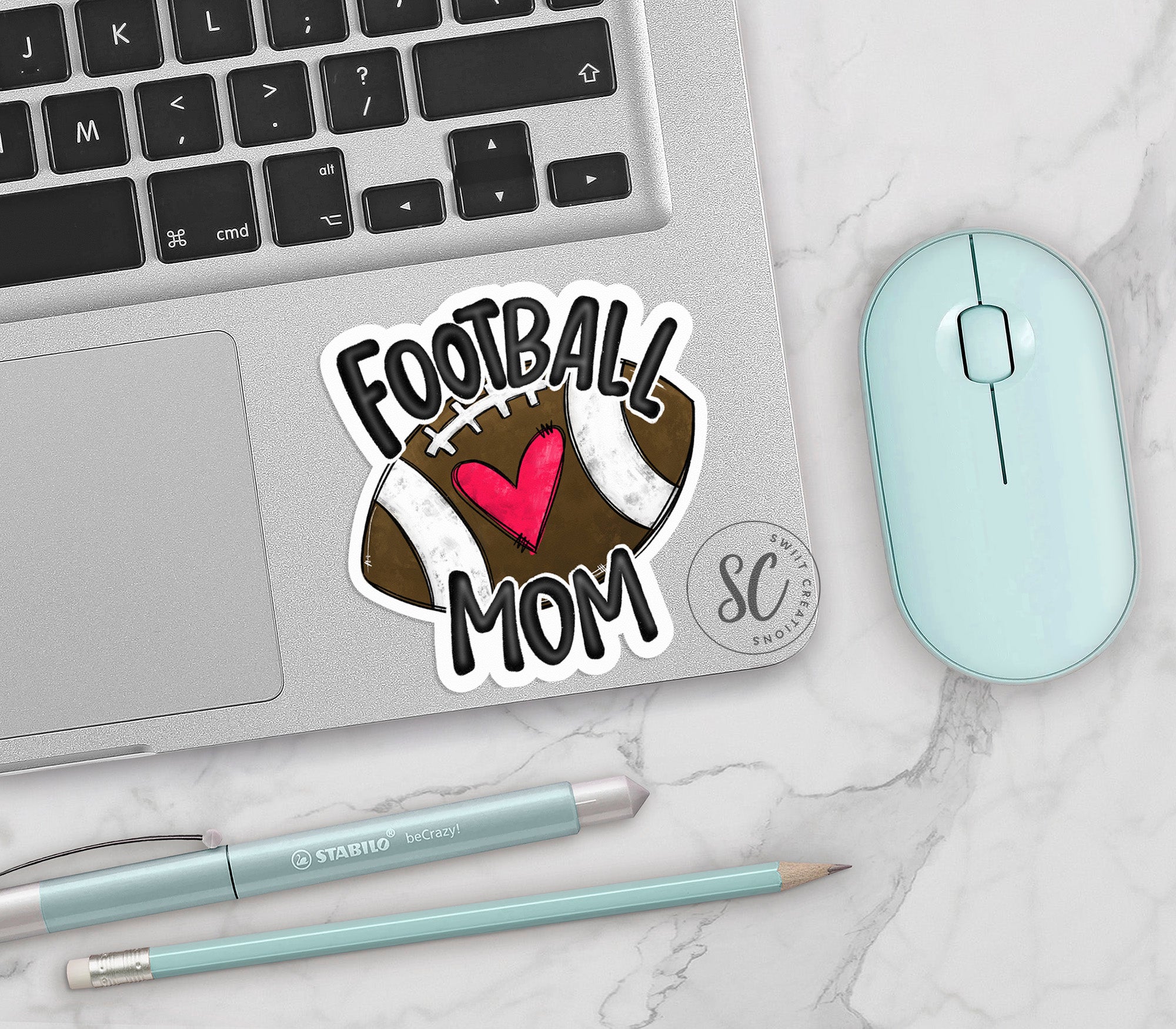 a football mom sticker next to a computer mouse