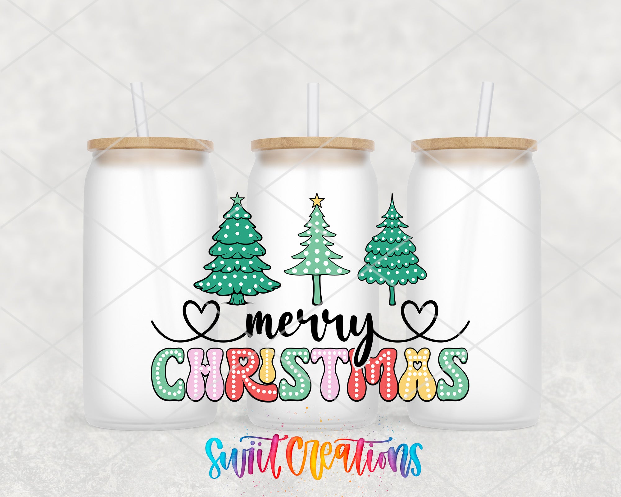 a couple of cups with christmas trees on them