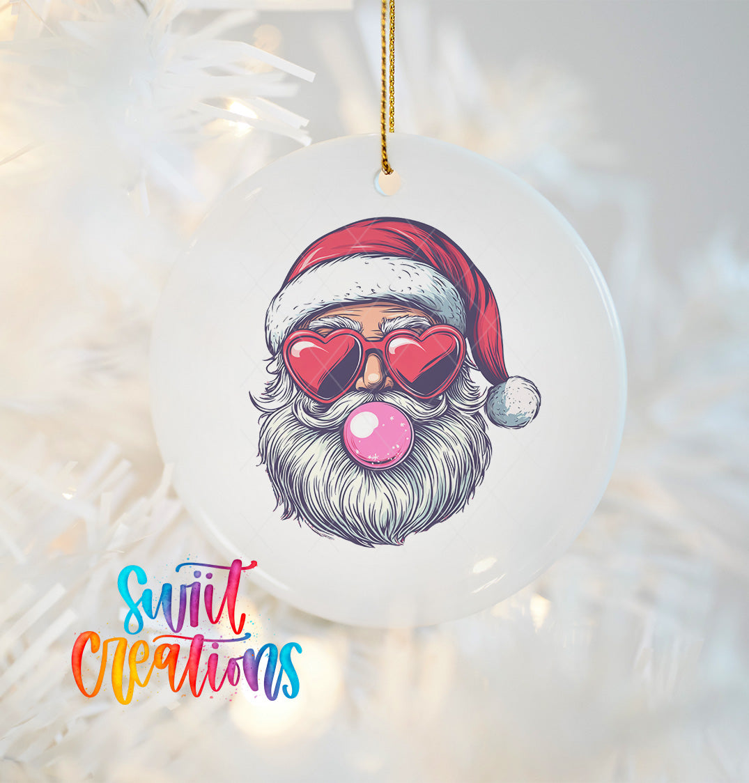 A white ornament with a Santa Claus face wearing sunglasses and a red hat, with a pink bubble gum bubble in his mouth.