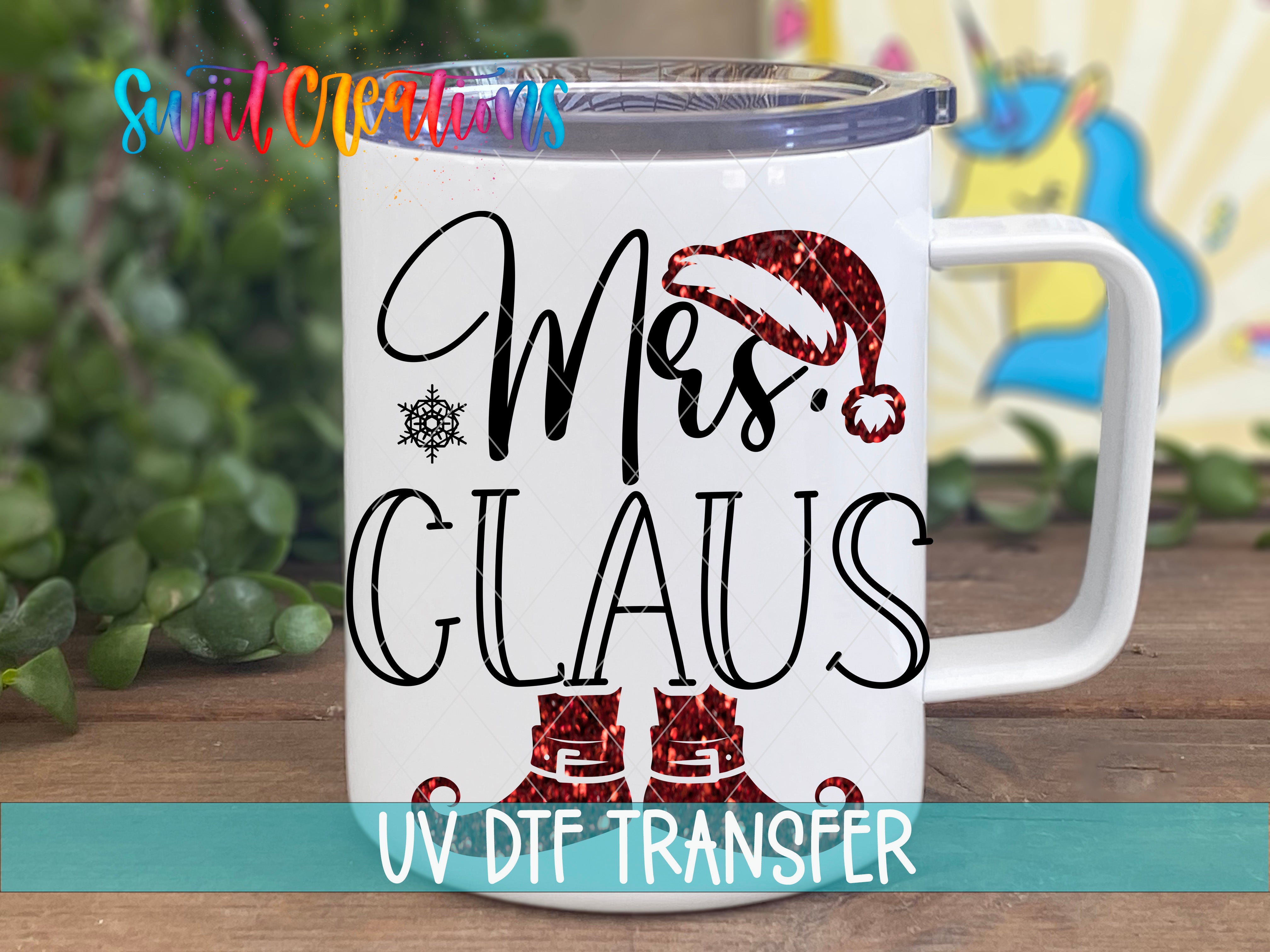 A white mug with a design featuring a Santa Claus hat and the text "Mrs. Claus" printed on it.