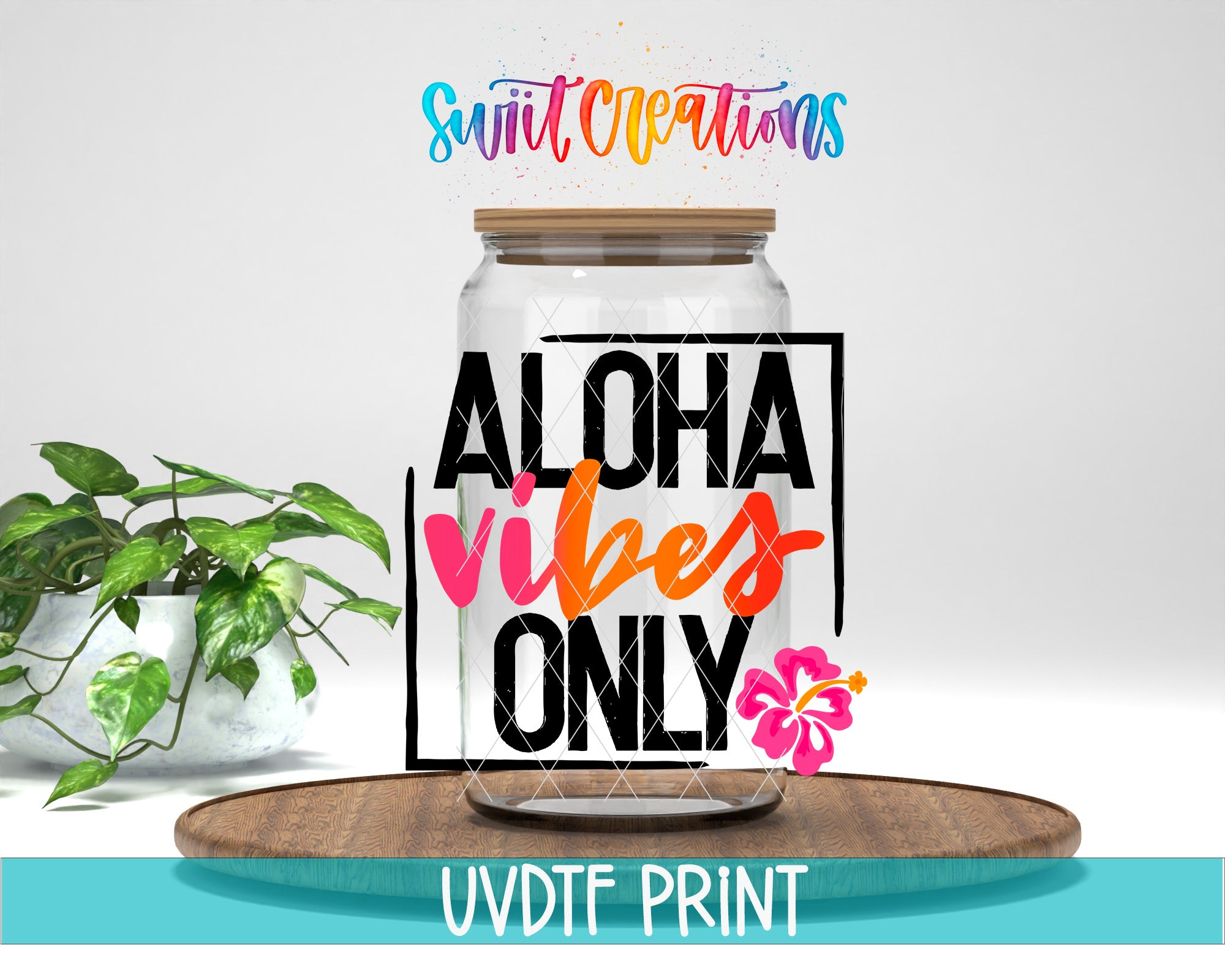 a large glass jar with a wooden lid, surrounded by a potted plant and a wooden tray. The text on the jar reads "ALOHA VIBES ONLY" and there is a pink flower on the tray.