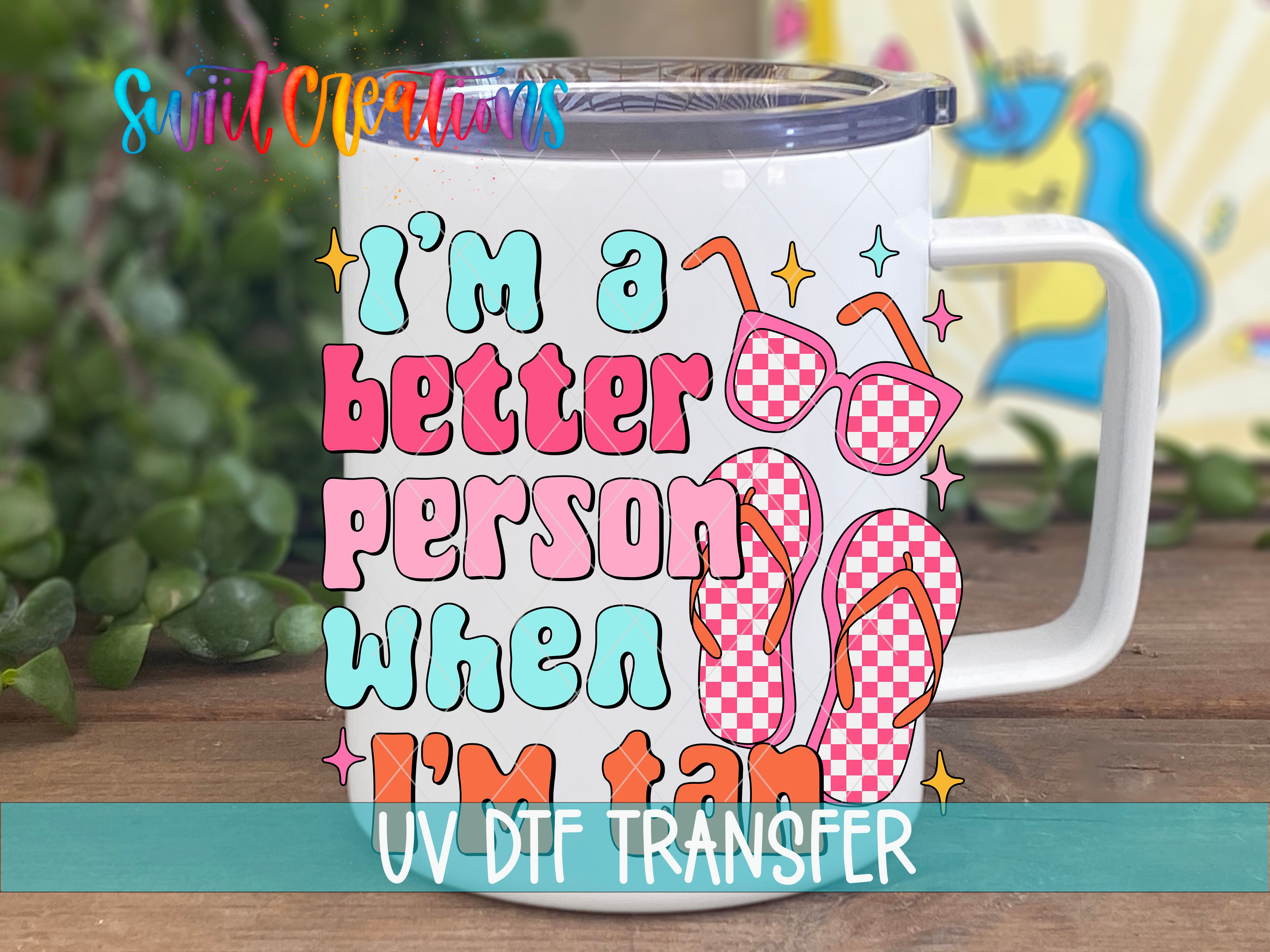 A white mug with a colorful design featuring sunglasses, a checkered pattern, and text that says "I'm a better person when I'm tan".