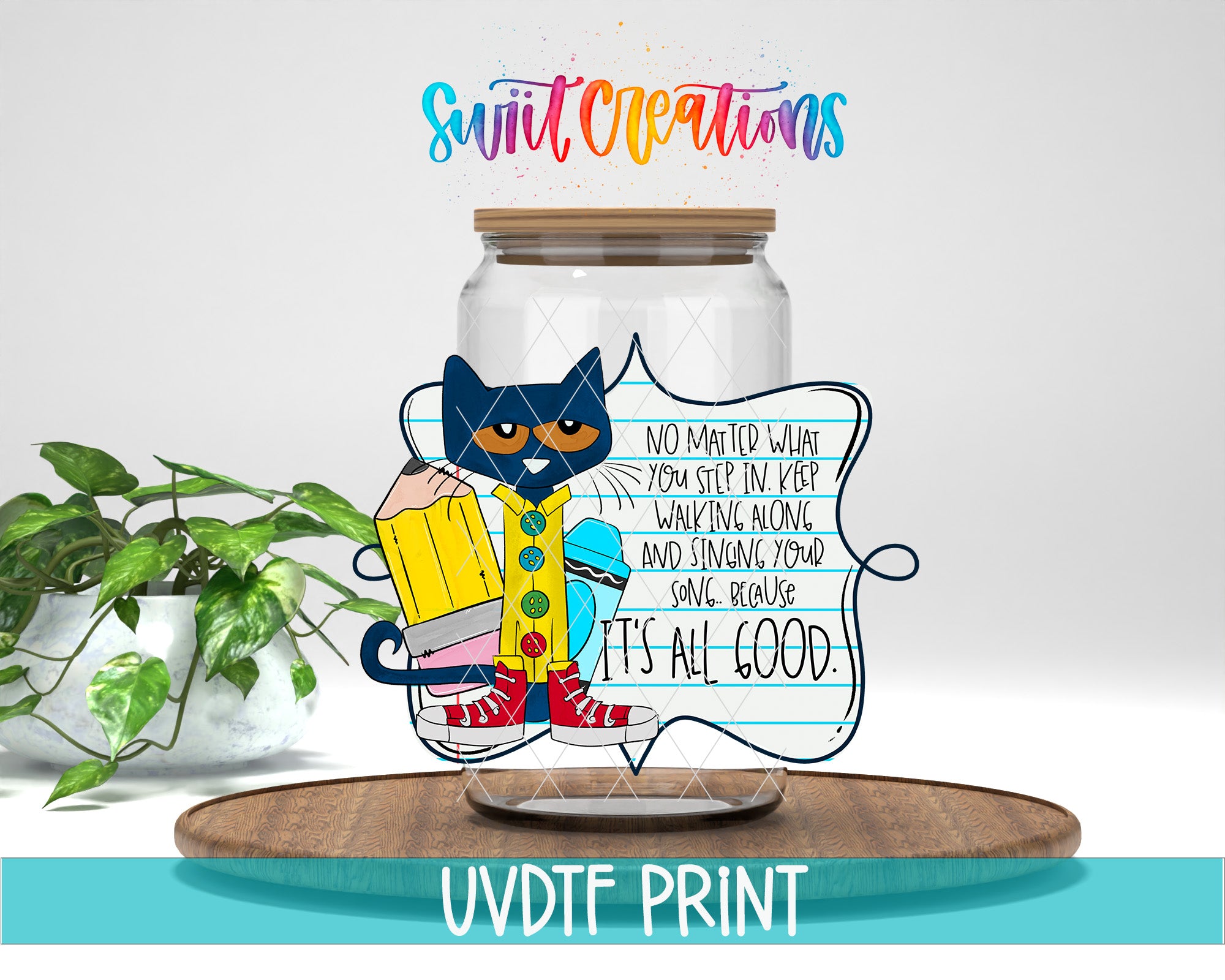 a glass jar with a picture of a cat inside of it