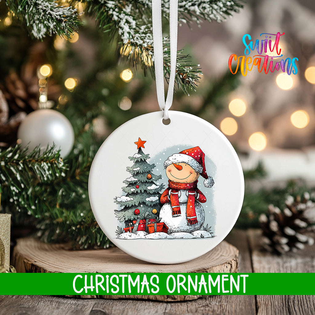 A white Christmas ornament featuring a snowman and a Christmas tree, with the text "Christmas ornament" below it.