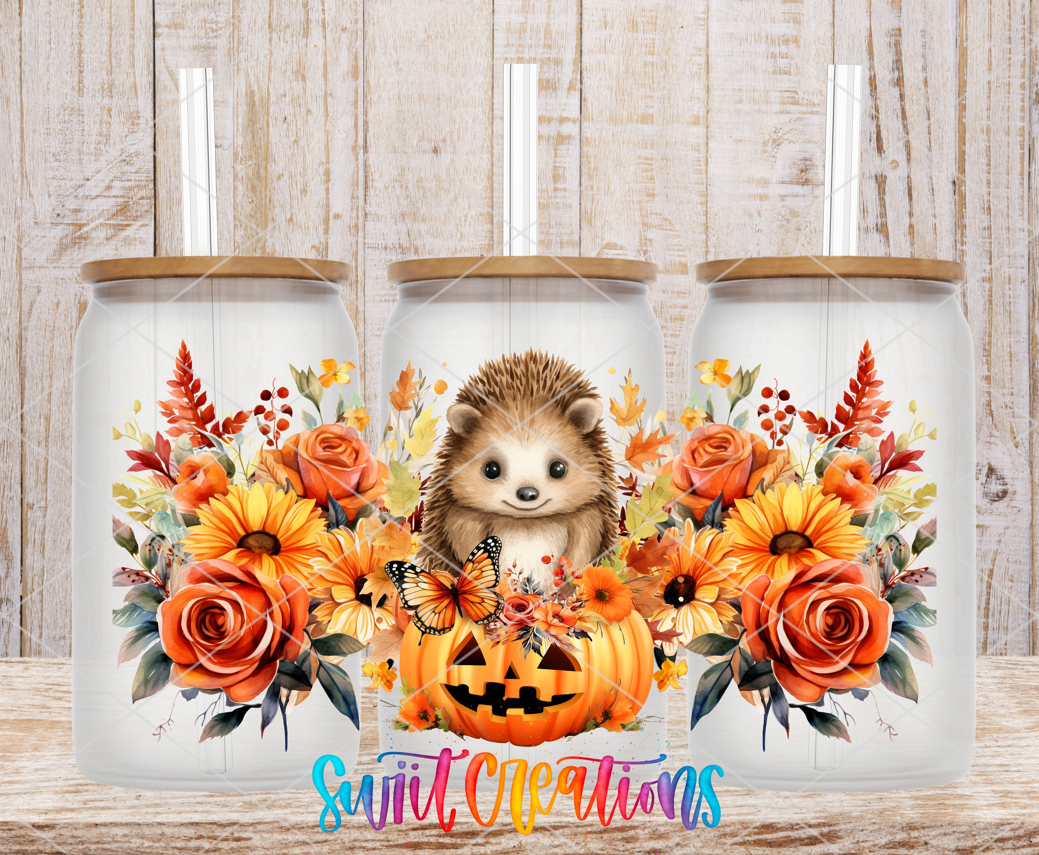 A collage of three glass jars with floral designs, including a hedgehog, pumpkins, and butterflies. The jars have straws attached to their lids.