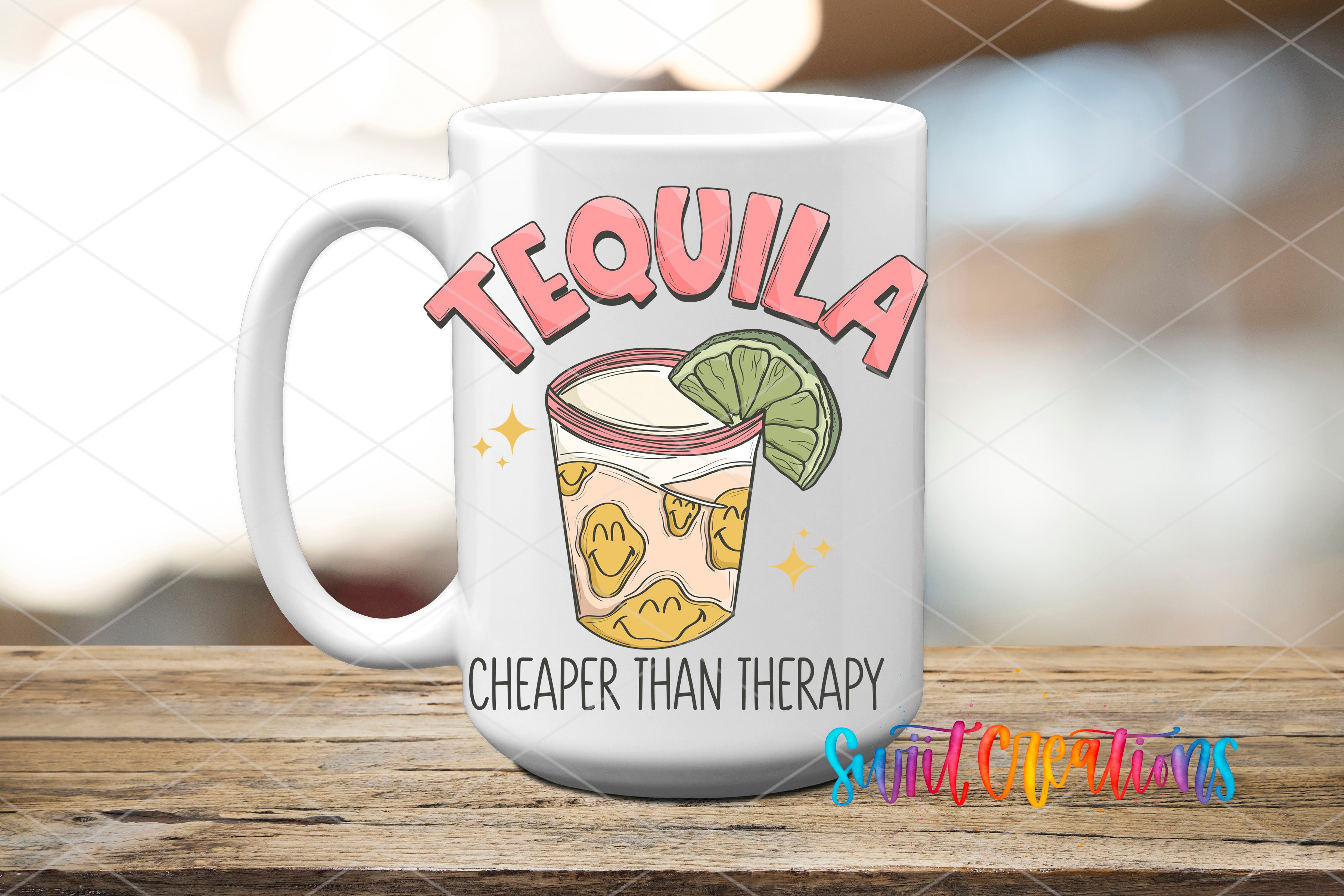 A white ceramic mug with a colorful design featuring a tequila glass and a lime slice, along with the text "TEQUILA" and "CHEAPER THAN THERAPY" printed on it.