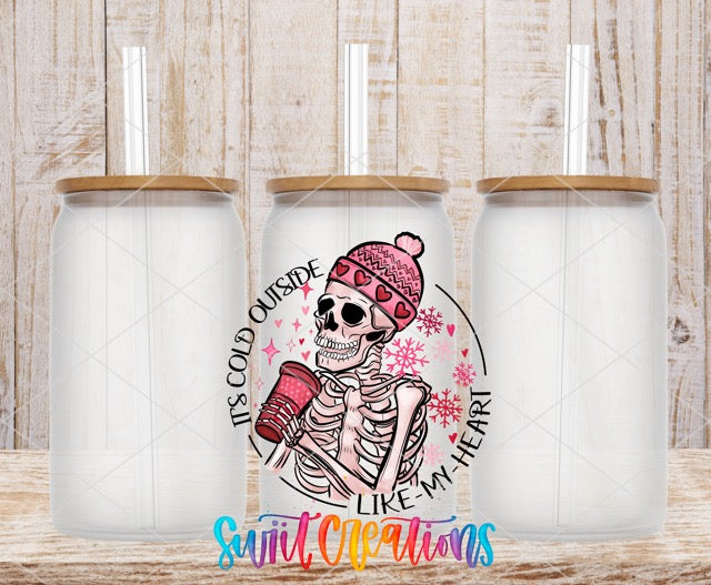 two white tumbles with a skeleton wearing a pink hat