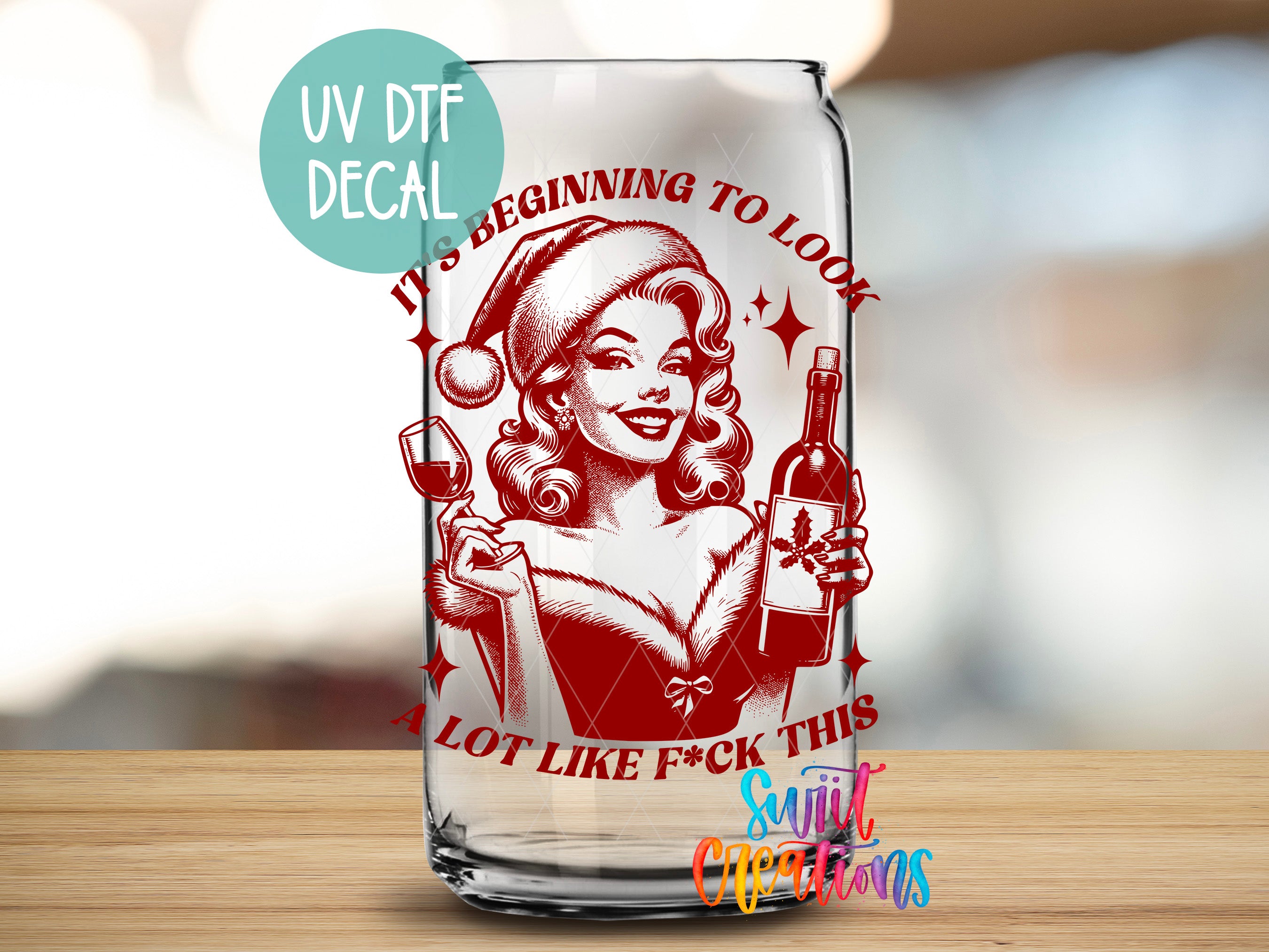 a glass with a picture of a woman holding a bottle