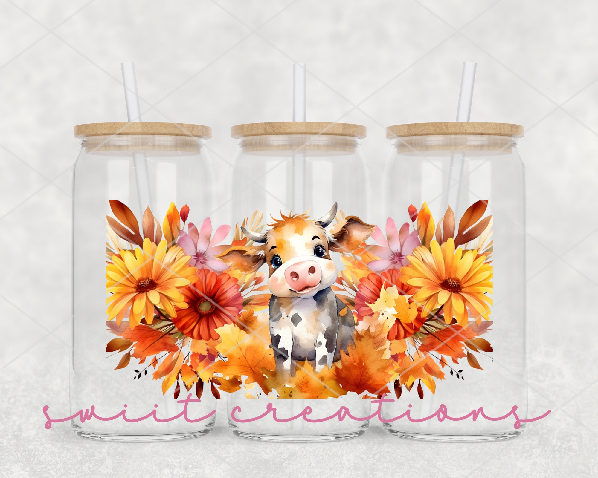 a couple of mason jars with a picture of a cow
