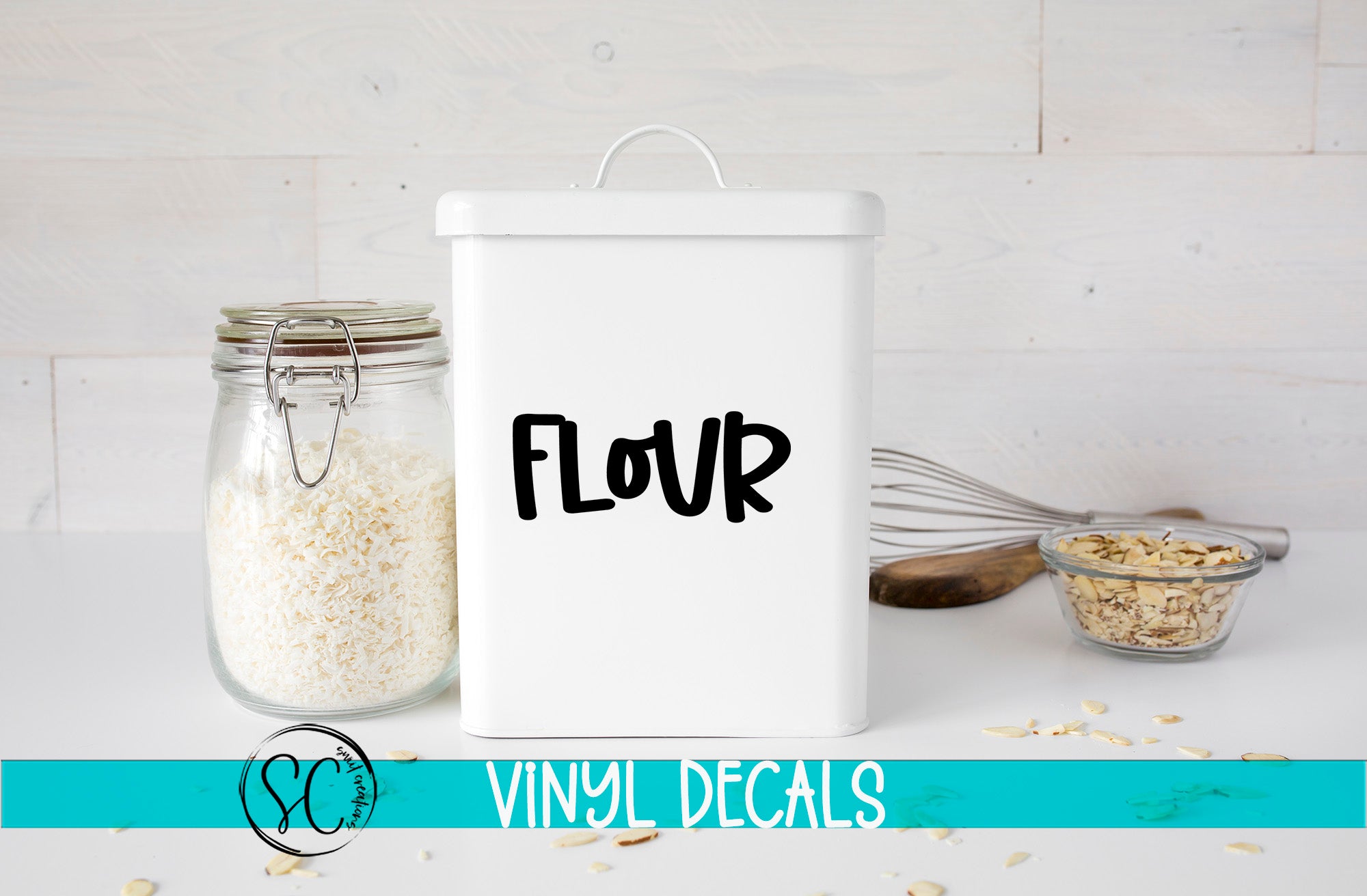 a white canister with the word flour next to it
