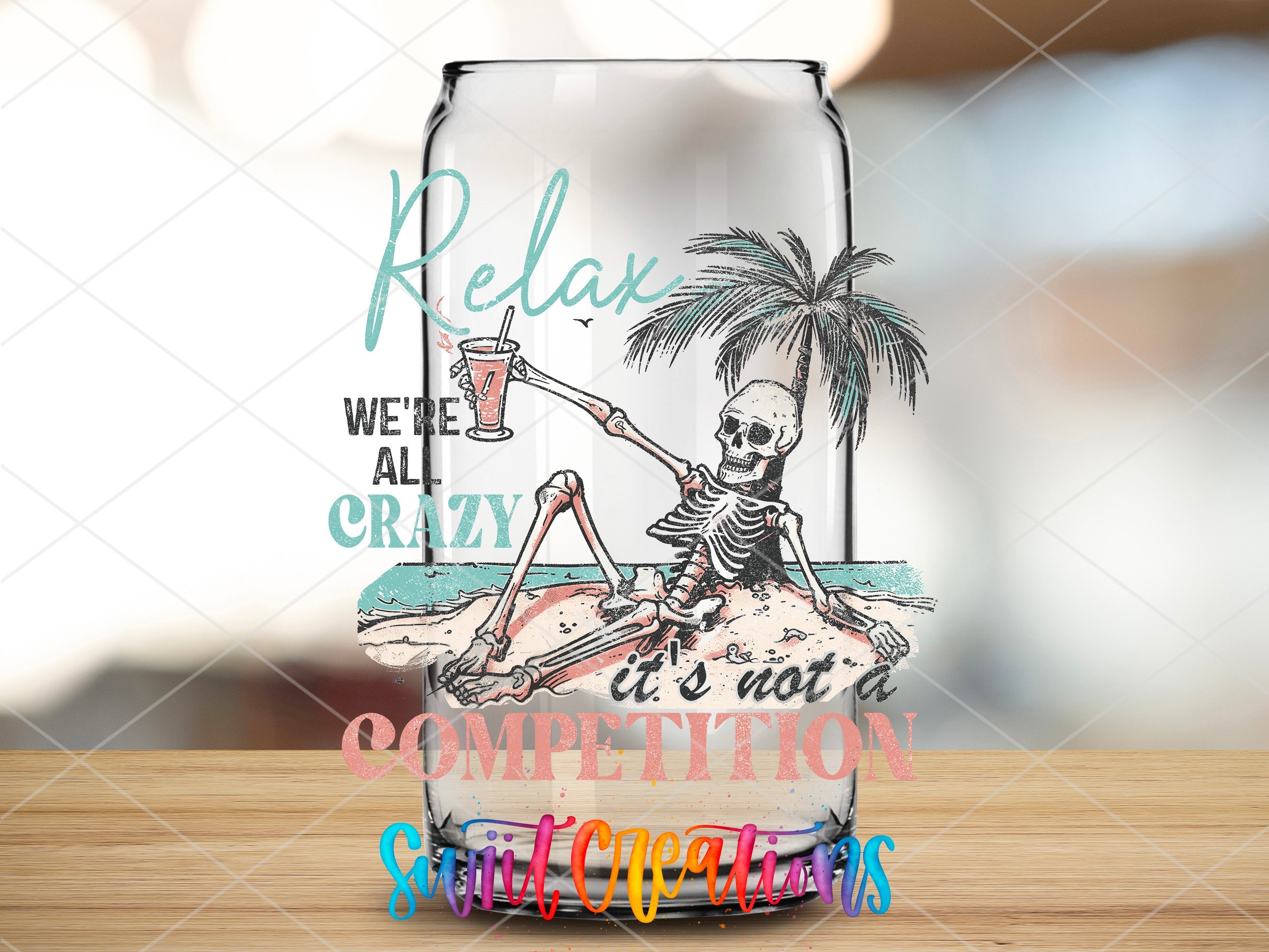 a glass with a skeleton sitting on top of it
