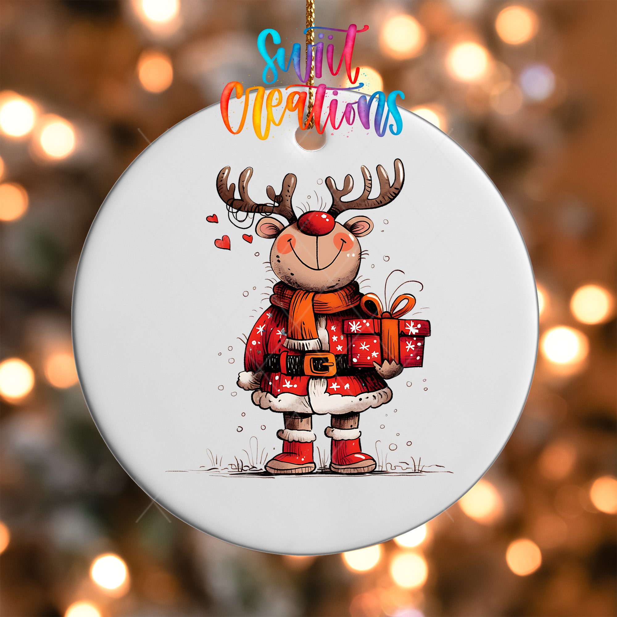 A white ornament featuring a cartoon reindeer holding a gift box and wearing a red scarf.