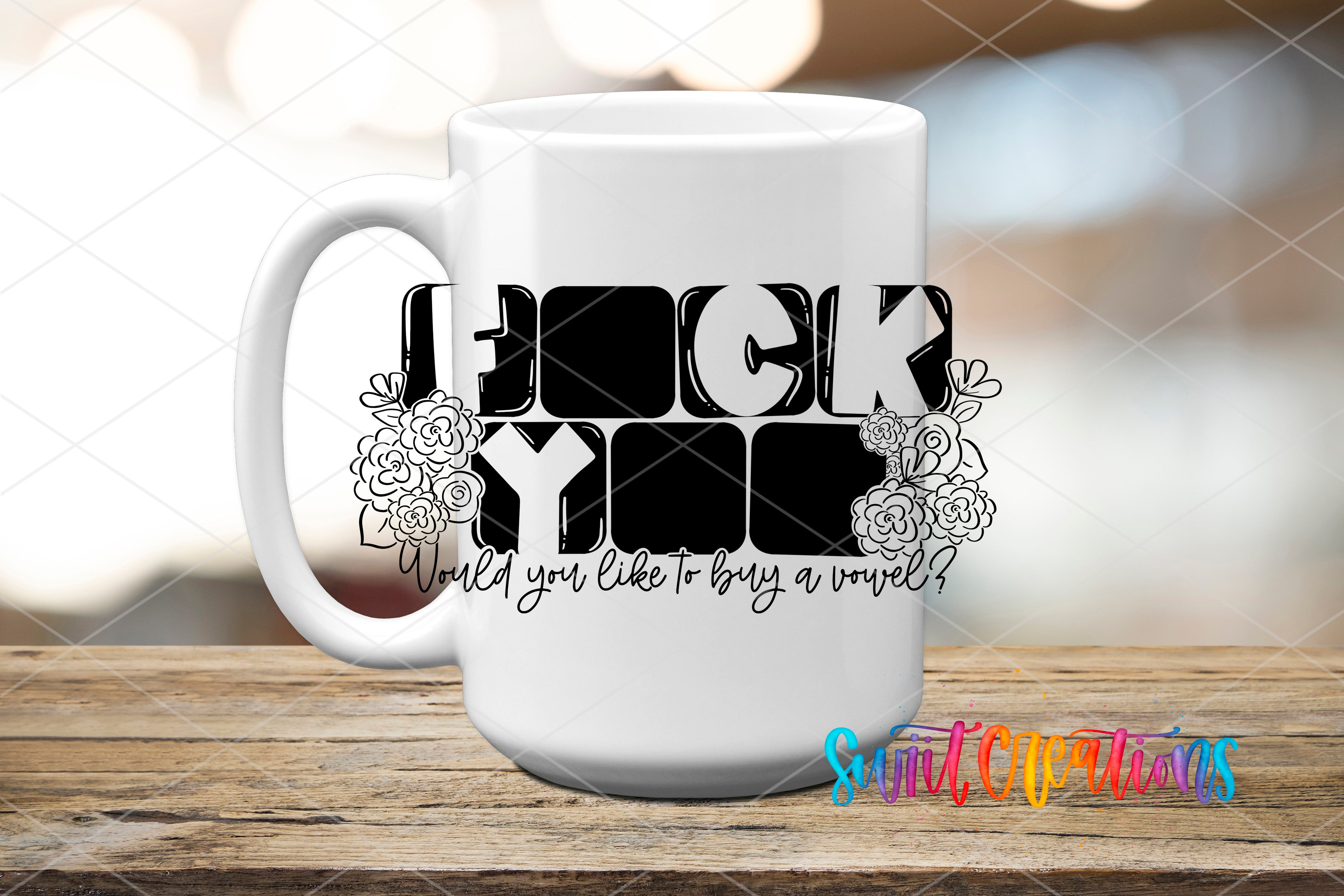 A white mug with a black and white graphic design featuring the text "FUCK YOU" and floral elements.