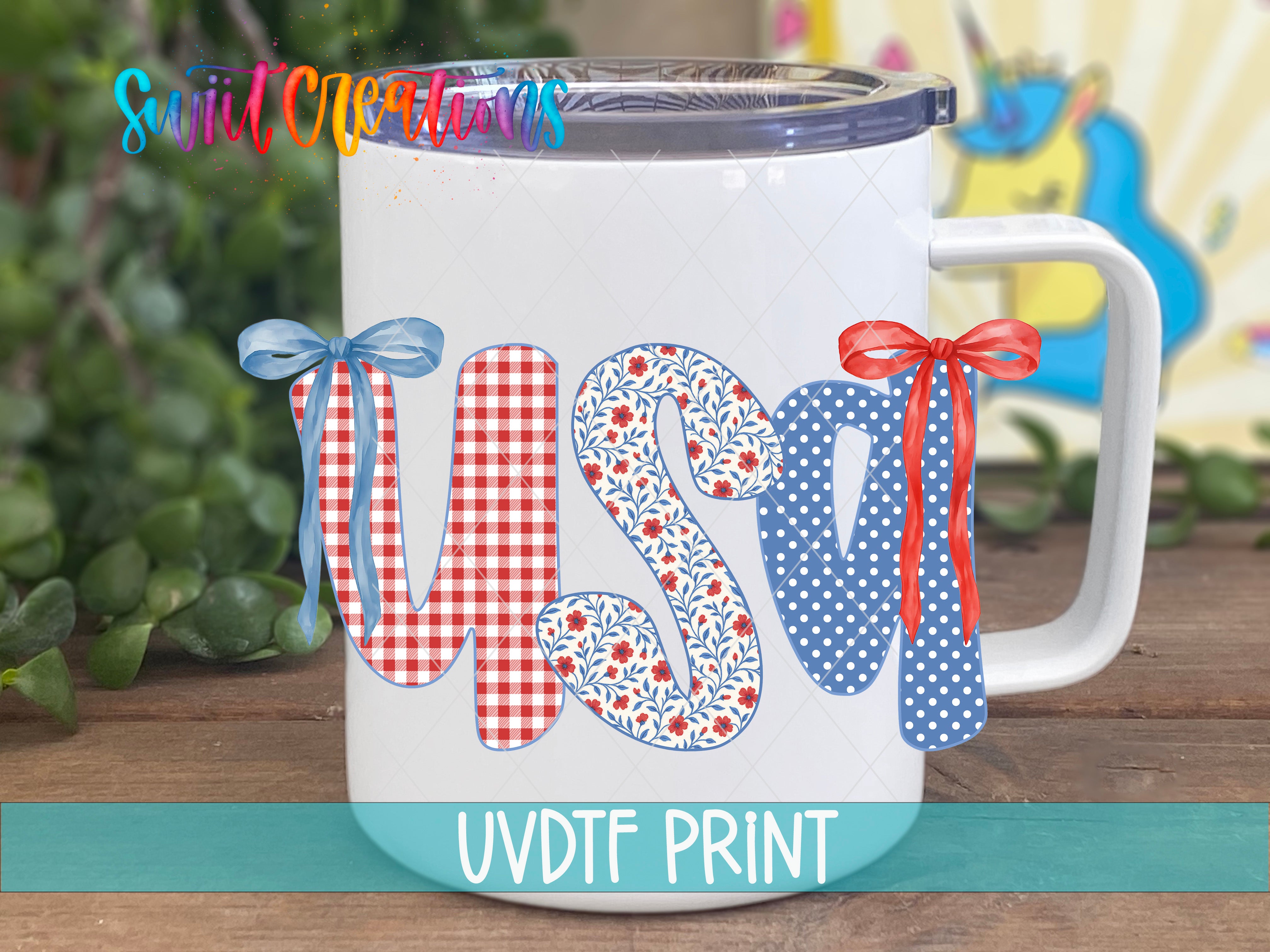 A white mug with the word "USA" printed on it, featuring colorful ribbons and floral designs.