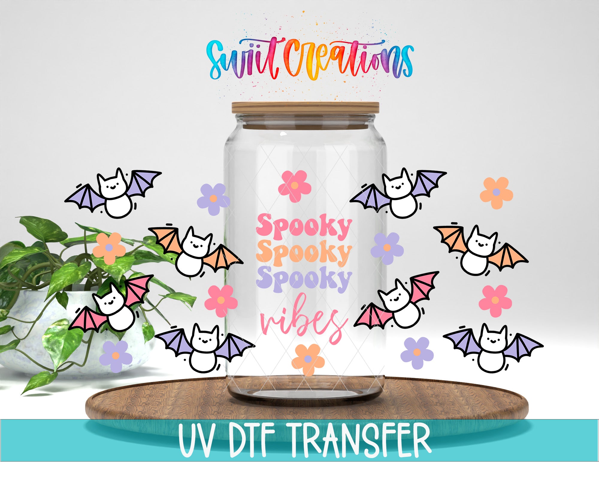 a glass jar with a lid, surrounded by bats and flowers, with the text "Spooky Spooky Vibes" and "Swit Creations" written on it.