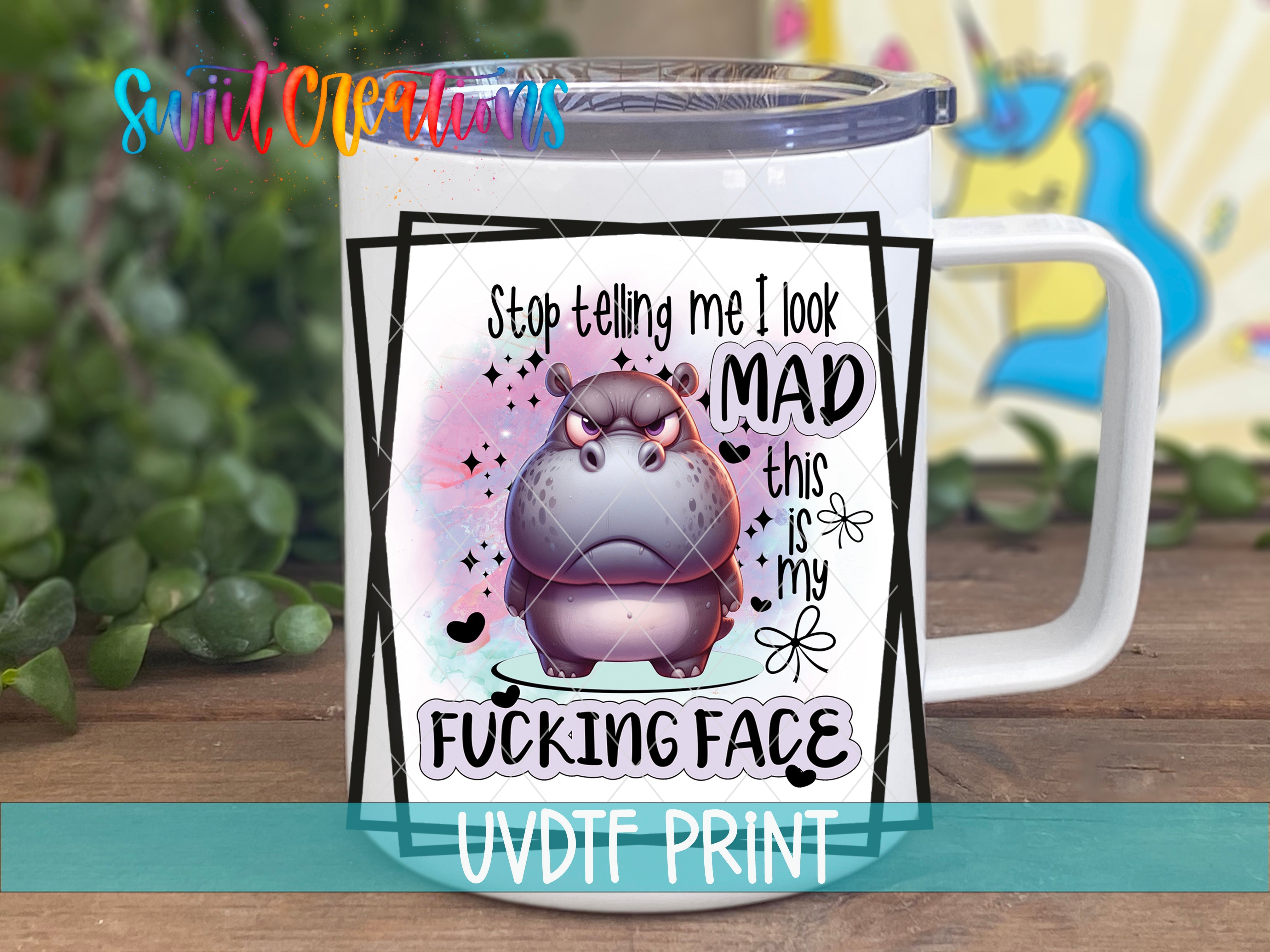 a white coffee mug with a hippo on it