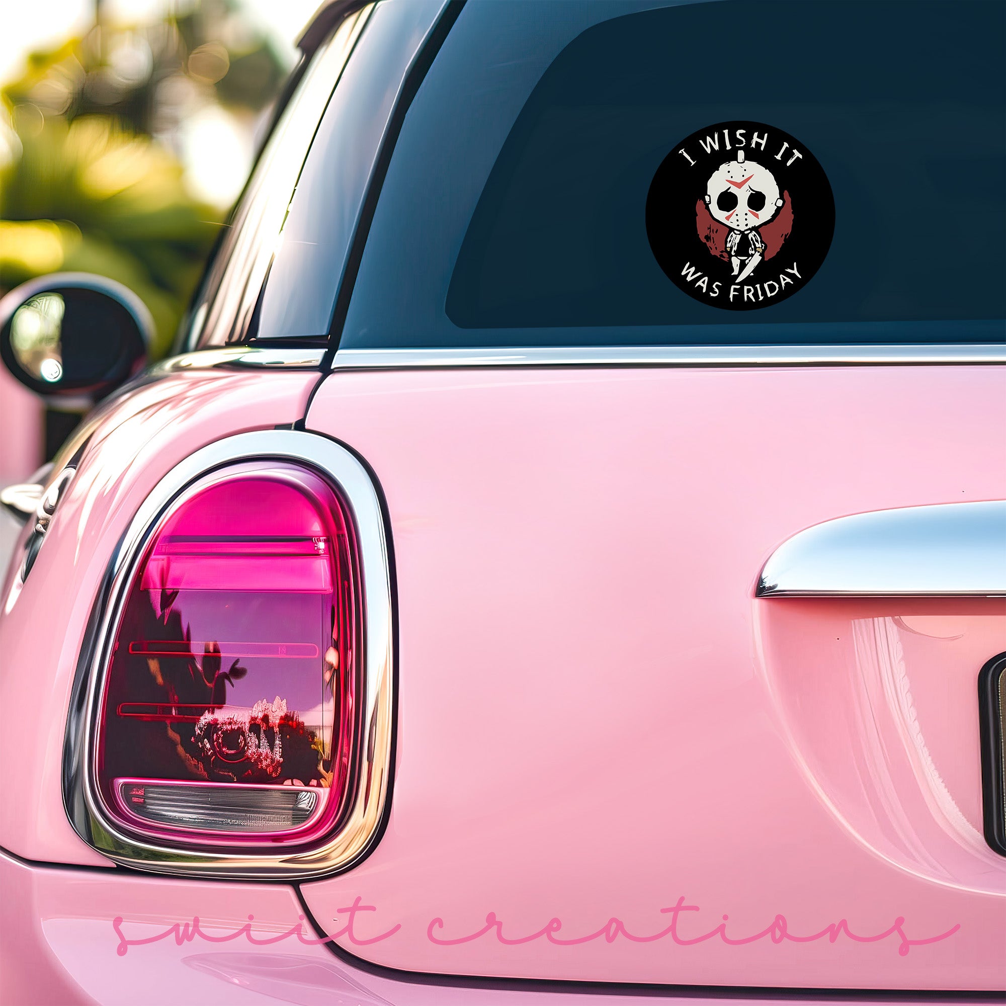a pink car with a skull sticker on it