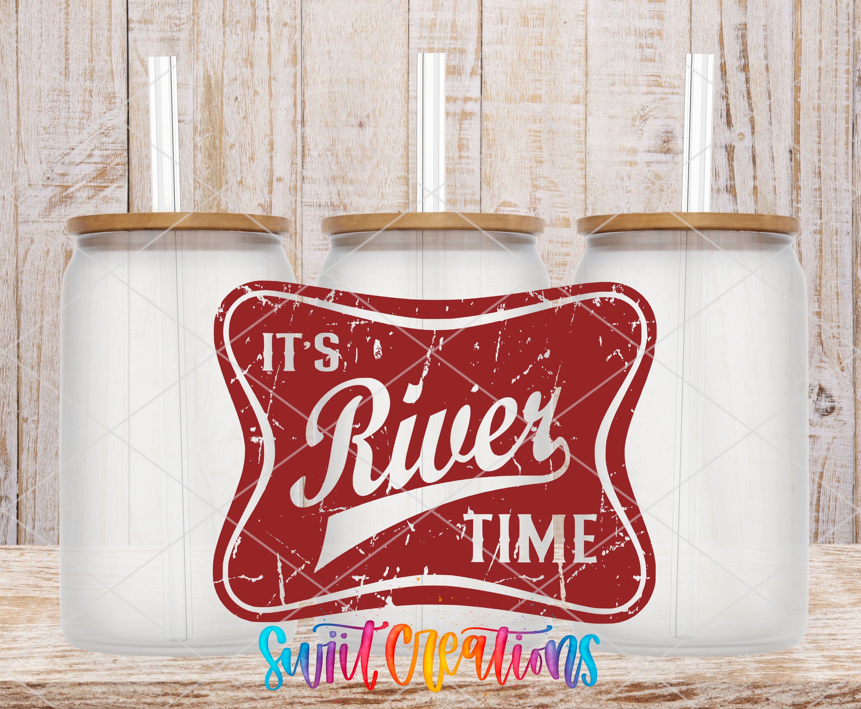 three clear glass jars with wooden lids, arranged in a row against a wooden background. The jars have straws sticking out of the tops. The phrase "It's River Time" is prominently displayed in the center of the image, and the text "Sweet Creations" is written in the bottom right corner.