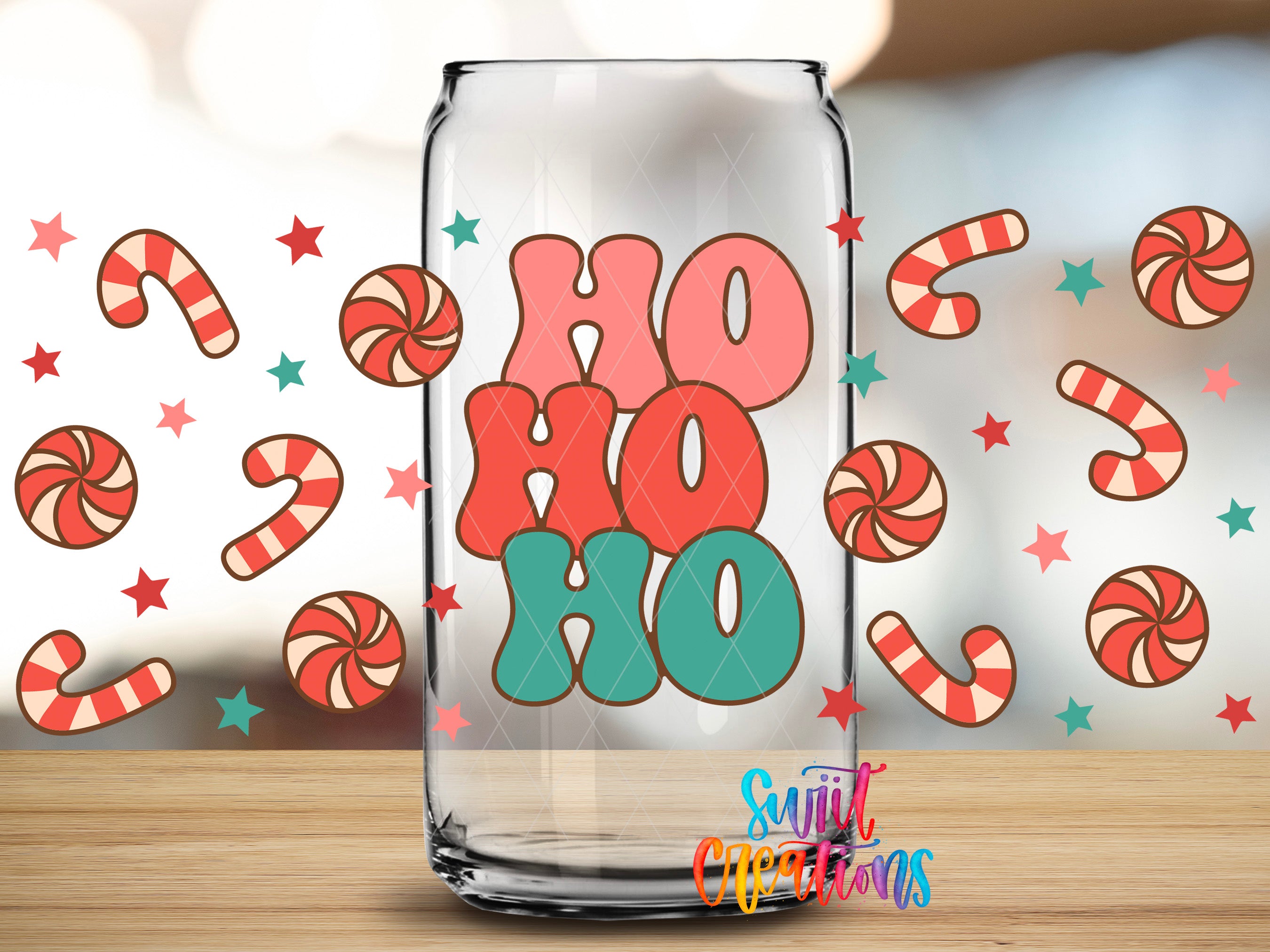 A glass jar with the text "HO HO HO" printed on it, surrounded by candy canes and stars.