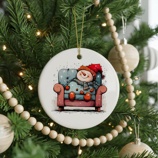 Santa Resting in a Holiday Armchair ceramic Christmas ornament, front view