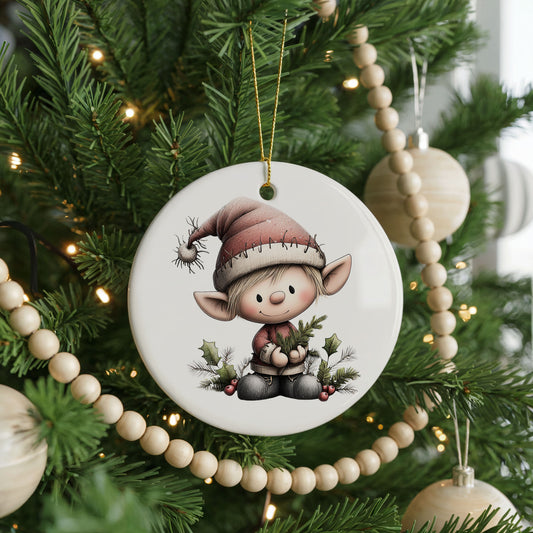 Whimsical Elf with Mini Christmas Tree ceramic Christmas ornament, front view