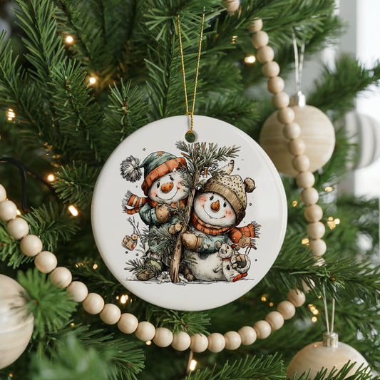 Snowman Couple with Evergreen Tree ceramic Christmas ornament, front view