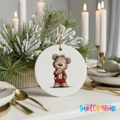 teddy bear holding a gingerbread cookie ceramic Christmas ornament shown in a holiday table setting