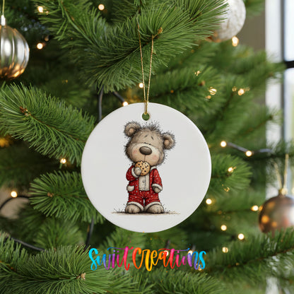 teddy bear holding a gingerbread cookie ceramic Christmas ornament hanging on a lit Christmas tree