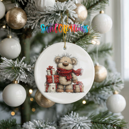 teddy bear with a red scarf and Christmas gifts ceramic Christmas ornament hanging on a frosted tree with ornaments