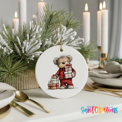 teddy bear carrying a stack of Christmas gifts ceramic Christmas ornament shown in a holiday table setting
