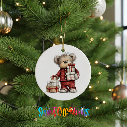 teddy bear carrying a stack of Christmas gifts ceramic Christmas ornament hanging on a lit Christmas tree