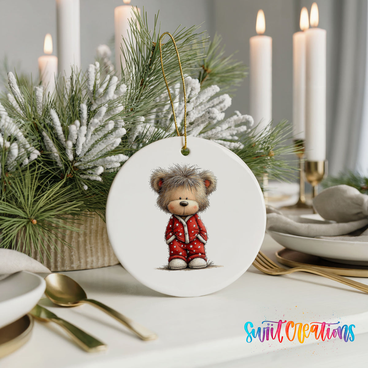 teddy bear wearing red Christmas pajamas ceramic Christmas ornament shown in a holiday table setting