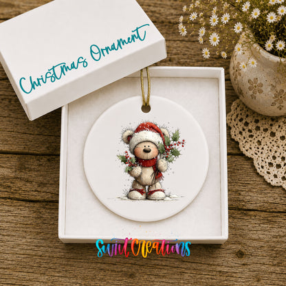 teddy bear framed by a Christmas wreath ceramic Christmas ornament presented in a gift box