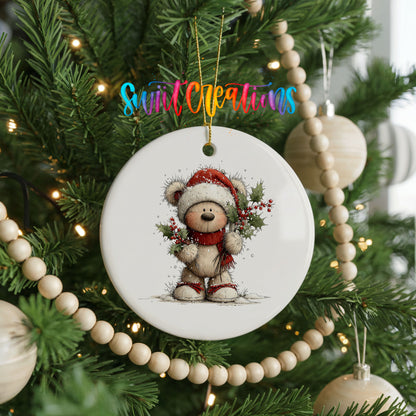 teddy bear framed by a Christmas wreath ceramic Christmas ornament hanging on a green Christmas tree