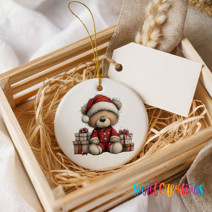 seated teddy bear with Christmas gifts ceramic Christmas ornament displayed in a wooden gift crate