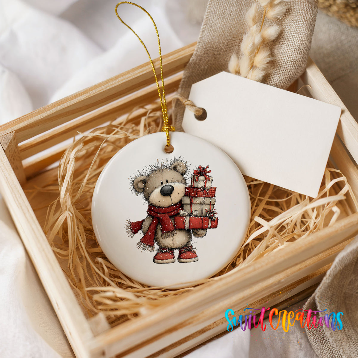 teddy bear in a red scarf carrying Christmas gifts ceramic Christmas ornament displayed in a wooden gift crate