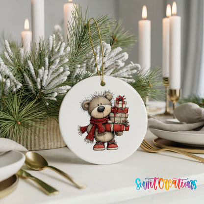 teddy bear in a red scarf carrying Christmas gifts ceramic Christmas ornament shown in a holiday table setting