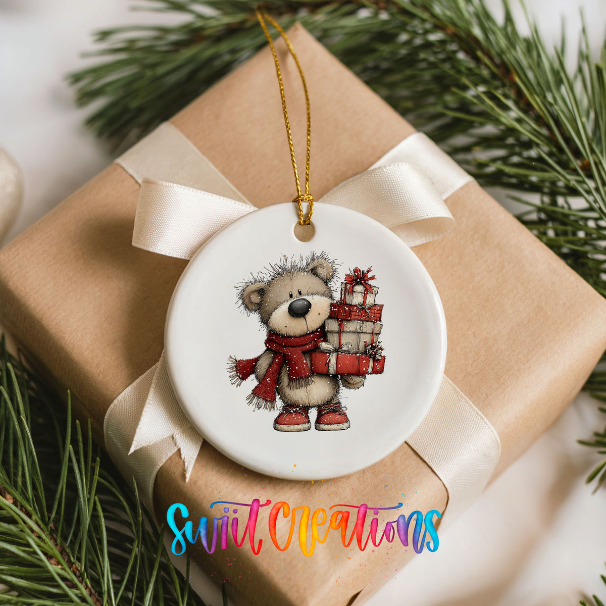 teddy bear in a red scarf carrying Christmas gifts ceramic Christmas ornament displayed on a wrapped Christmas gift