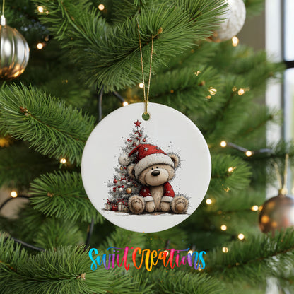 teddy bear sitting beside a decorated Christmas tree ceramic Christmas ornament hanging on a lit Christmas tree