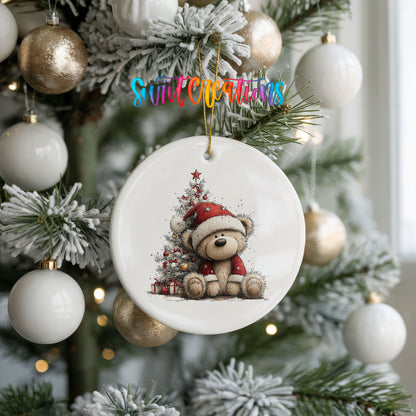 teddy bear sitting beside a decorated Christmas tree ceramic Christmas ornament hanging on a frosted tree with ornaments